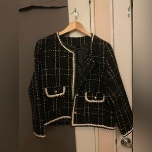 Stunning, black tweed blazer with shiny stitching and pearl buttons